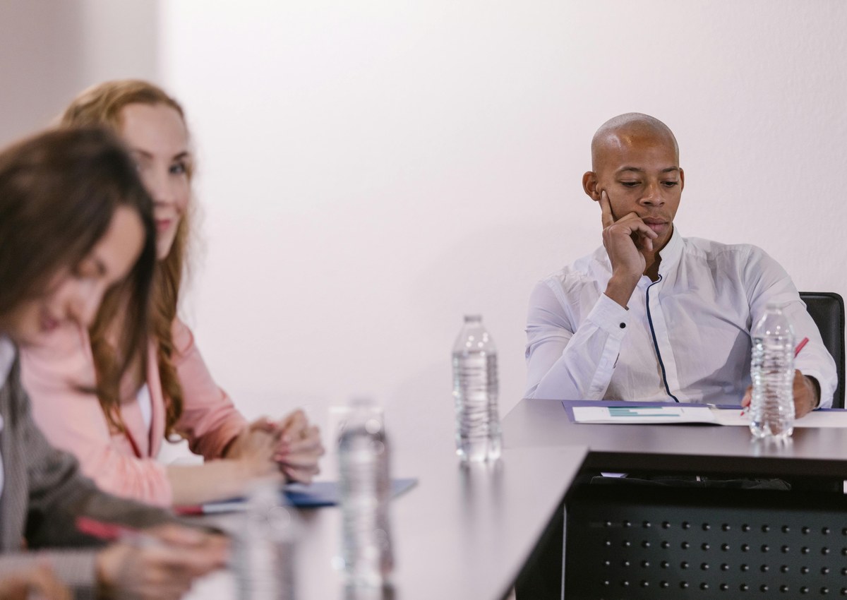 Professionals reviewing meeting details