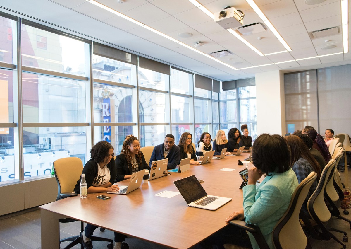 Business team in a meeting room discussing event requirements