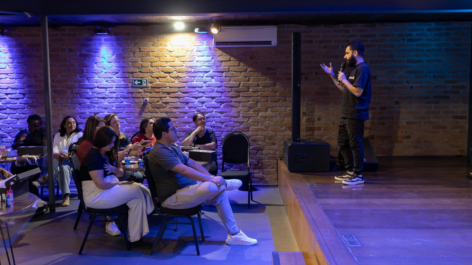Speaker presenting to attendees in a seminar room