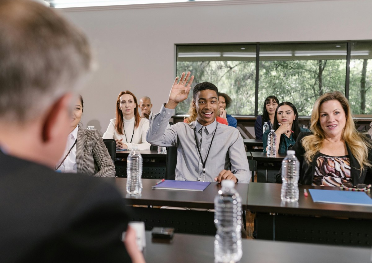 Professional workshop audience asking a question